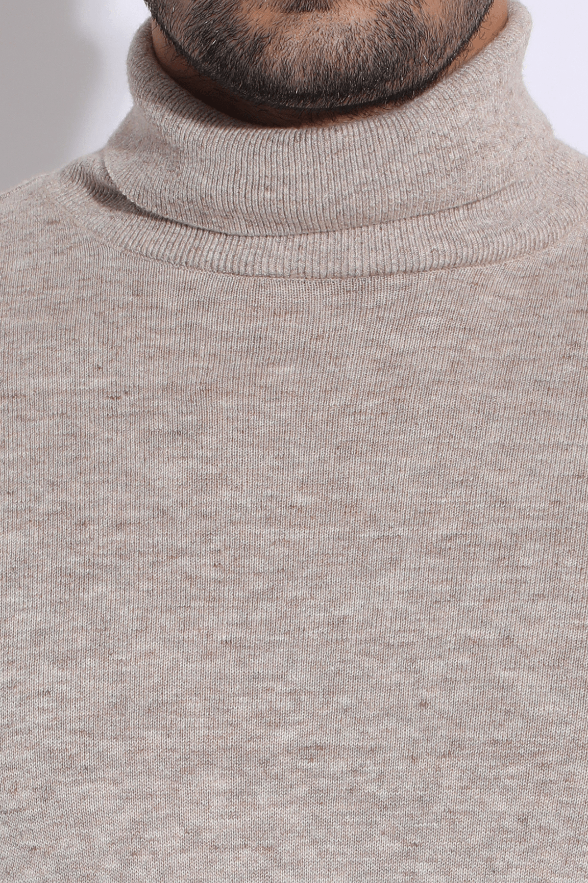 Beige textured long waist coat jacket with beige polo neck and brown trousers - Kunal Anil Tanna