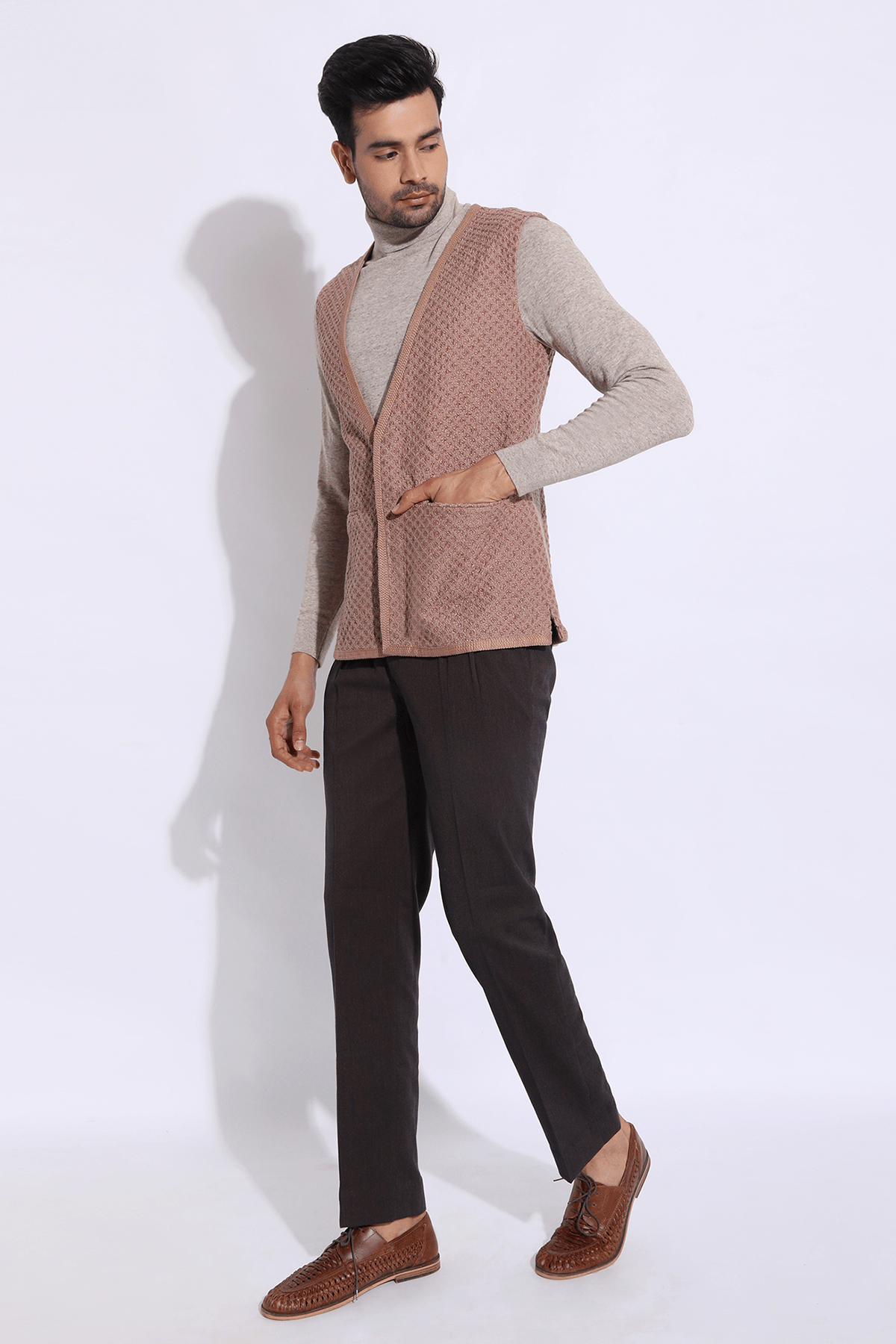 Beige textured long waist coat jacket with beige polo neck and brown trousers - Kunal Anil Tanna