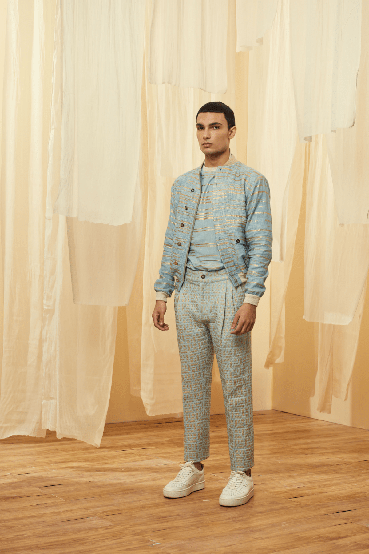 Blue Bomber Jacket with a Blue Poloneck and Blue Trousers - Kunal Anil Tanna
