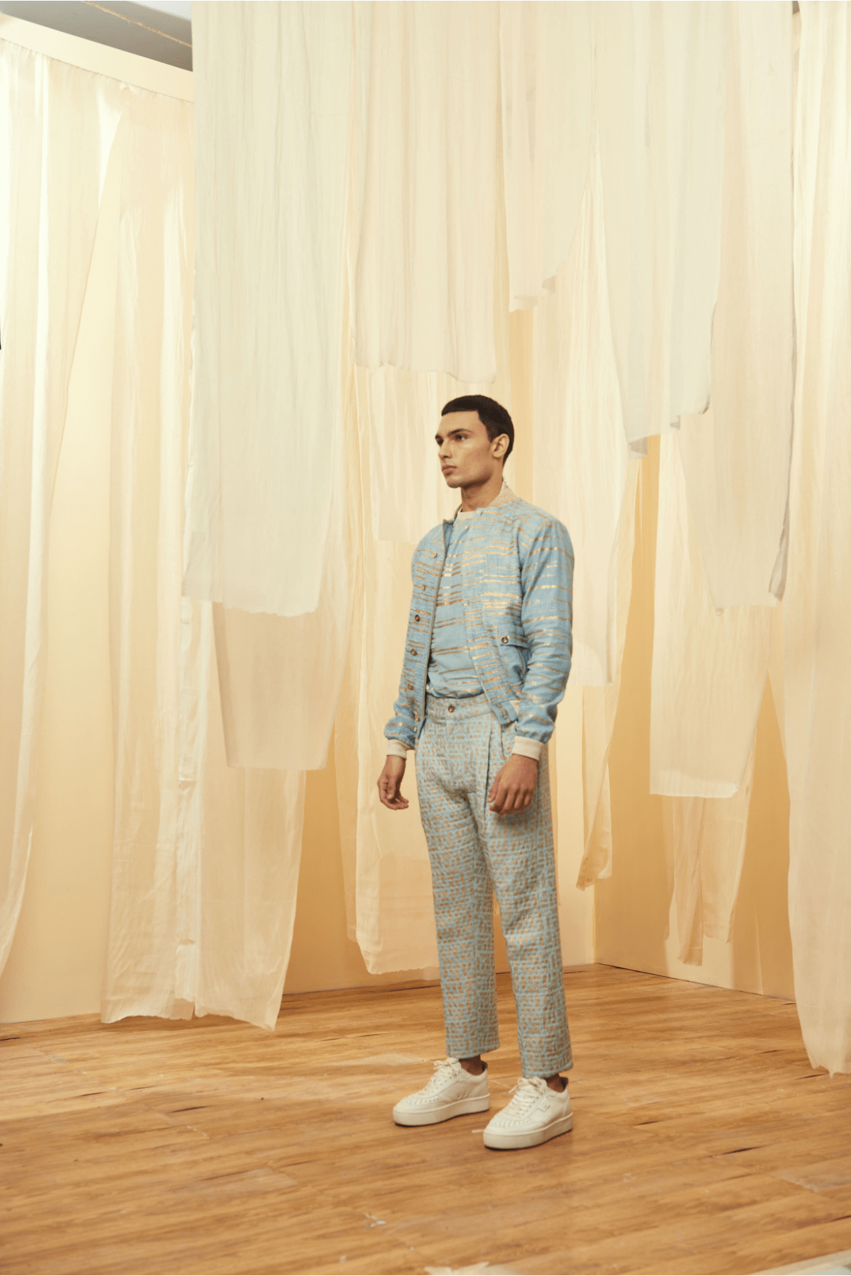 Blue Bomber Jacket with a Blue Poloneck and Blue Trousers - Kunal Anil Tanna