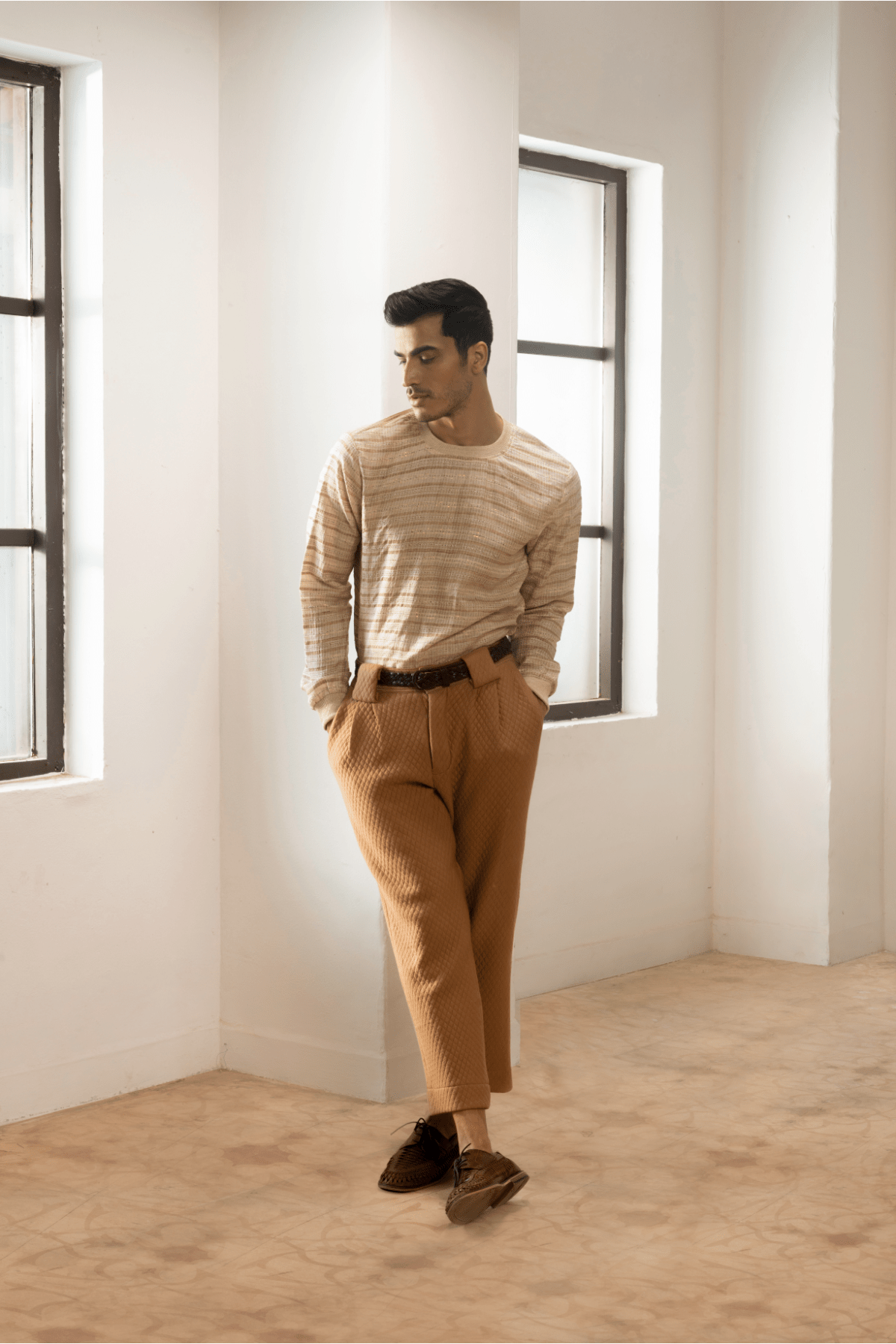 Green textured jacket with cream pullover and beige pants. - Kunal Anil Tanna