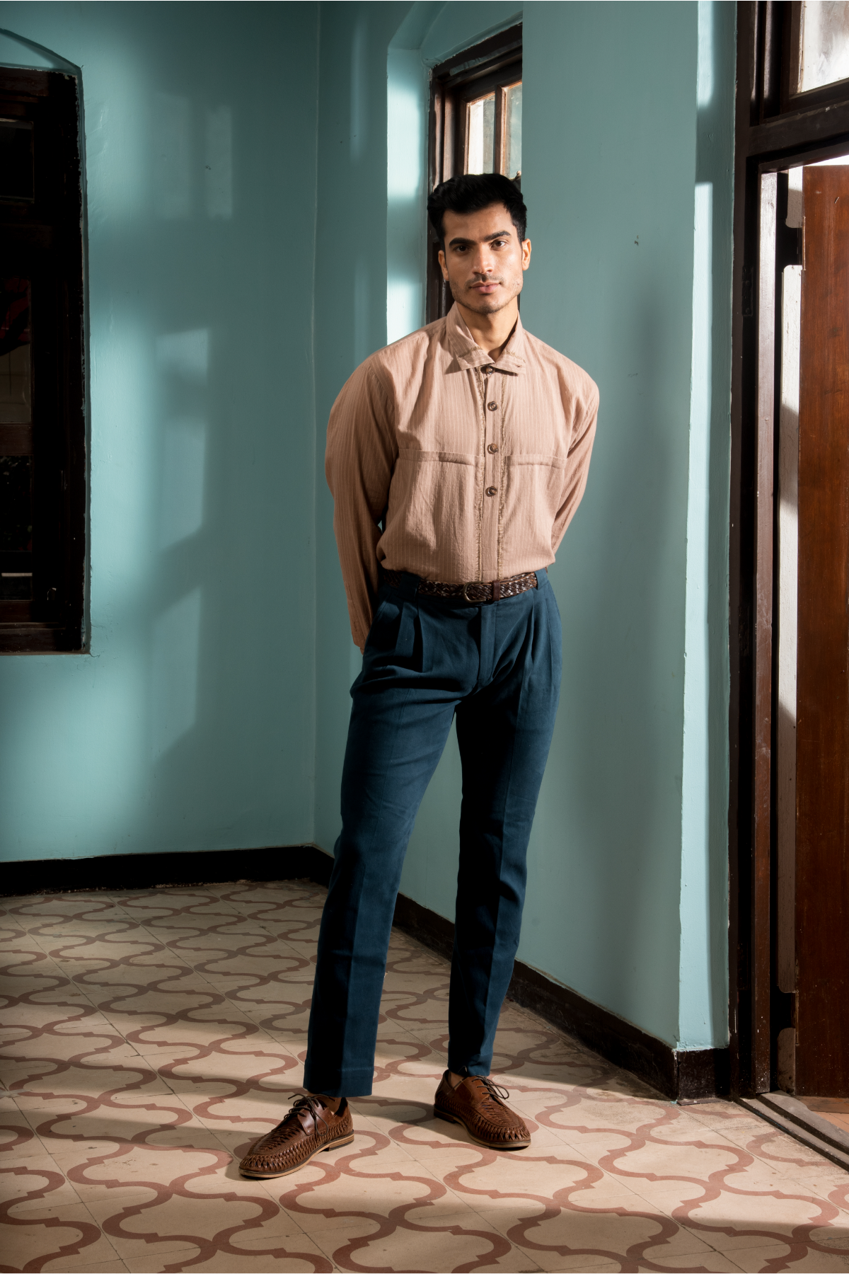 Salmon textured bandi jacket with salmon shirt and dark blue trousers - Kunal Anil Tanna