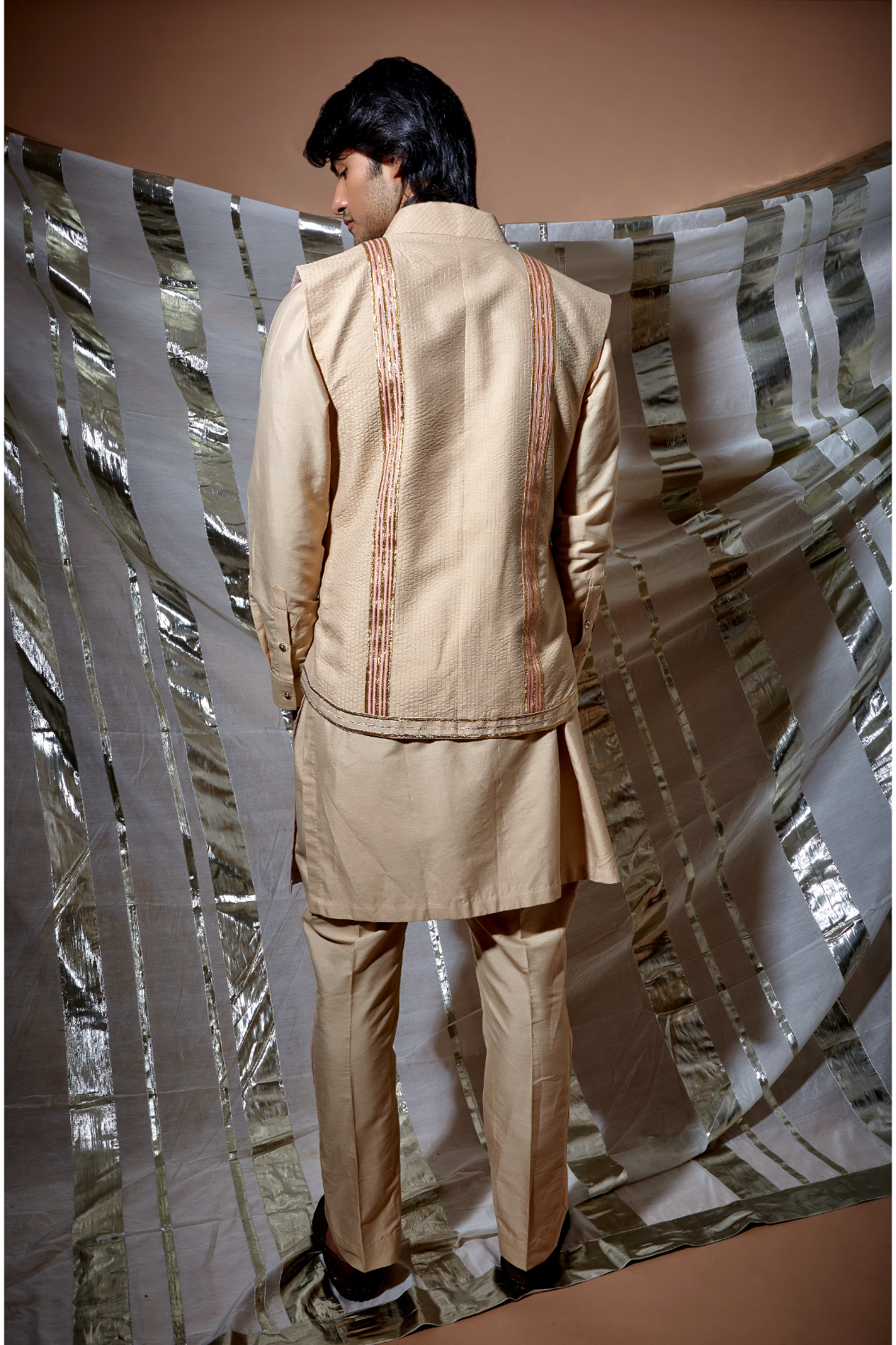 Beige zari textured bandi jacket with peach detail paired with kurta and pyjama pants - Kunal Anil Tanna
