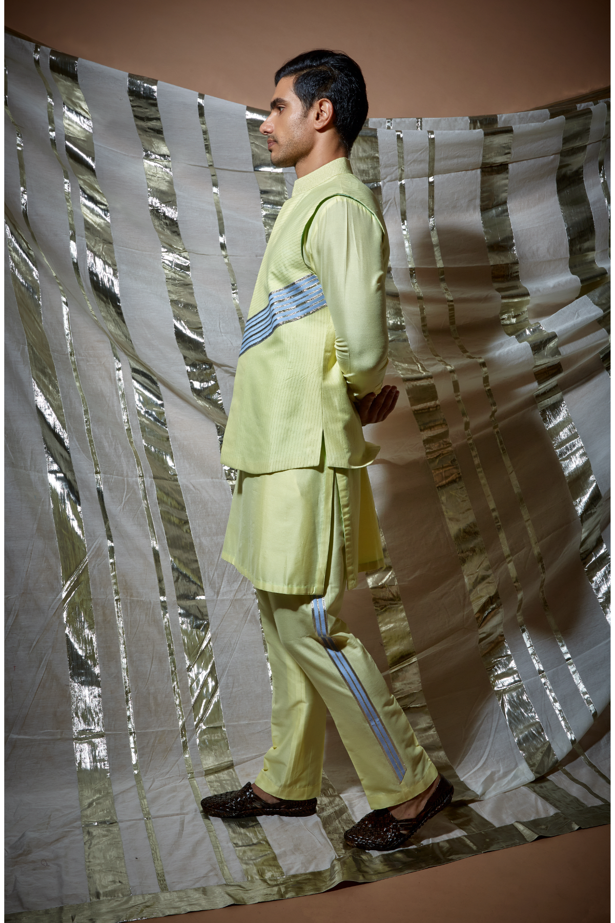 Yellow zari textured bandi jacket with blue detail paired with yellow kurta and pyjama pants - Kunal Anil Tanna