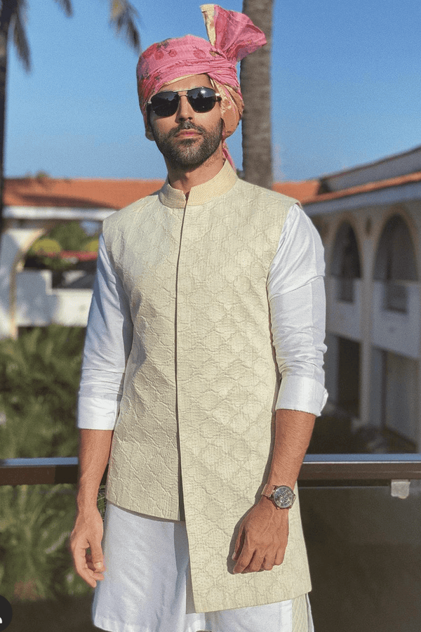 Smaran Sahu In Ivory long and short bandi jacket with white kurta and aligarhipants - Kunal Anil Tanna