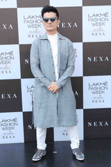 Meiyang Chang In Blue long shirt with white polo neck and white trousers - Kunal Anil Tanna