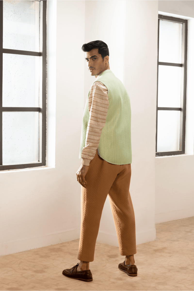 Green textured jacket with cream pullover and beige pants. - Kunal Anil Tanna