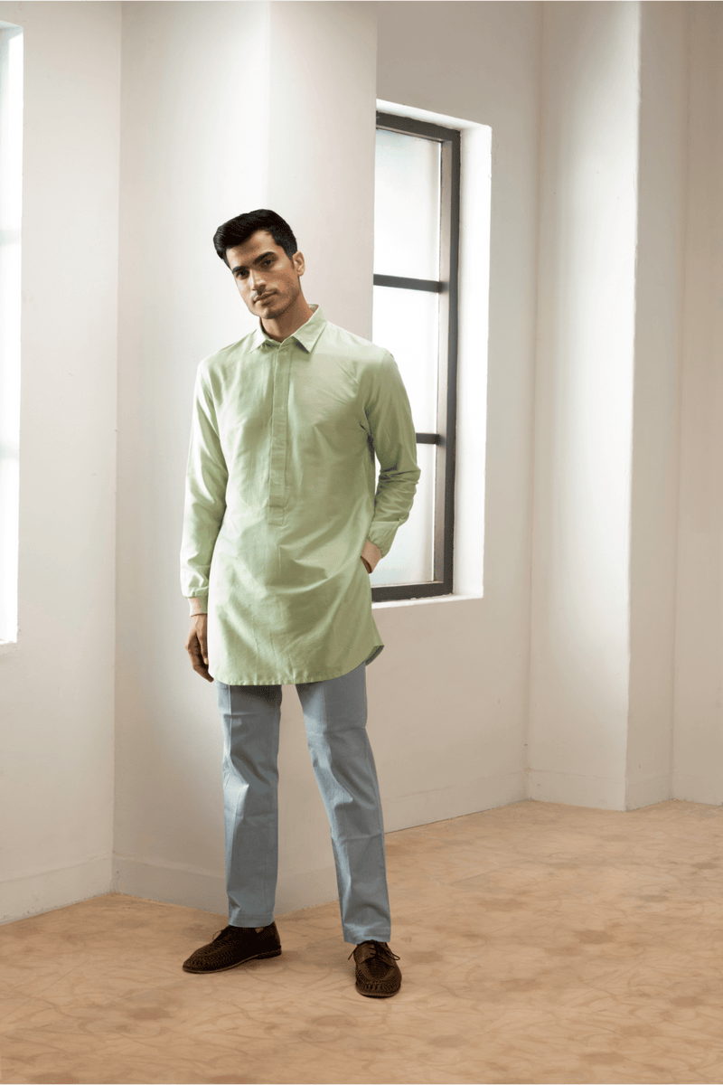 Green textured double layer jacket worn with kurta and blue trousers - Kunal Anil Tanna