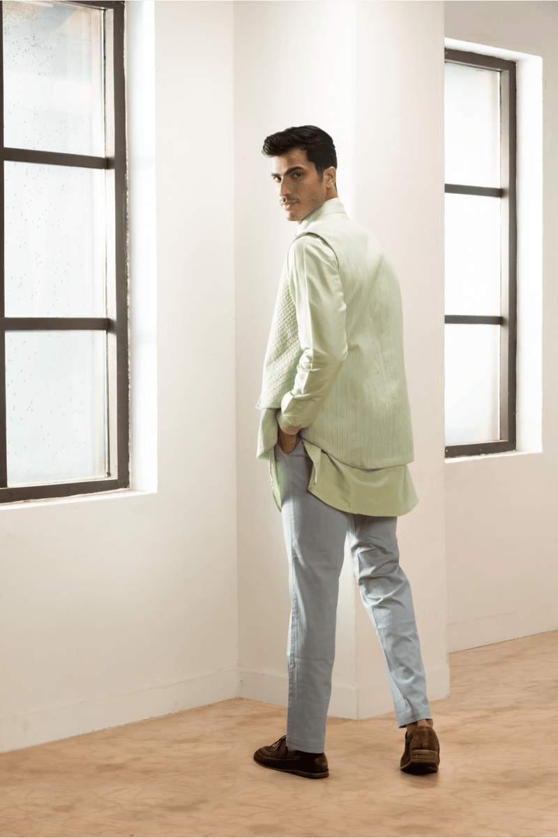 Green textured double layer jacket worn with kurta and blue trousers - Kunal Anil Tanna