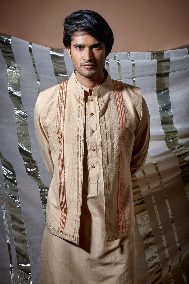 Beige zari textured bandi jacket with peach detail paired with kurta and pyjama pants - Kunal Anil Tanna