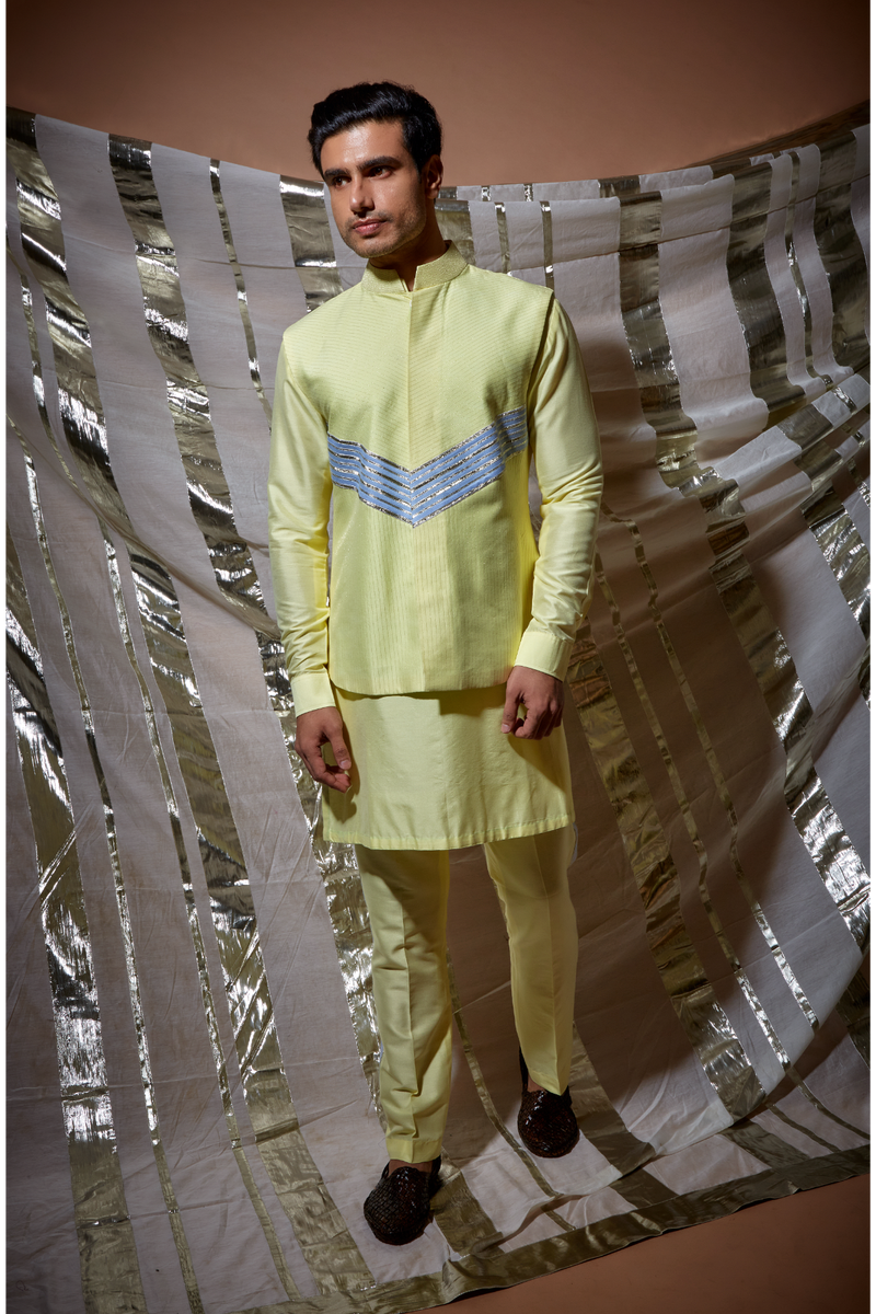 Yellow zari textured bandi jacket with blue detail paired with yellow kurta and pyjama pants - Kunal Anil Tanna