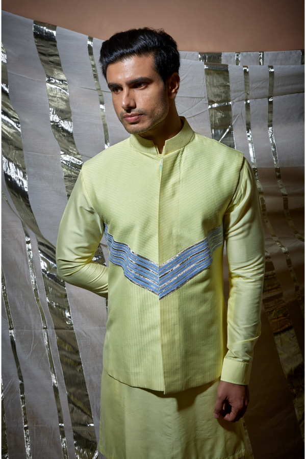 Yellow zari textured bandi jacket with blue detail paired with yellow kurta and pyjama pants - Kunal Anil Tanna
