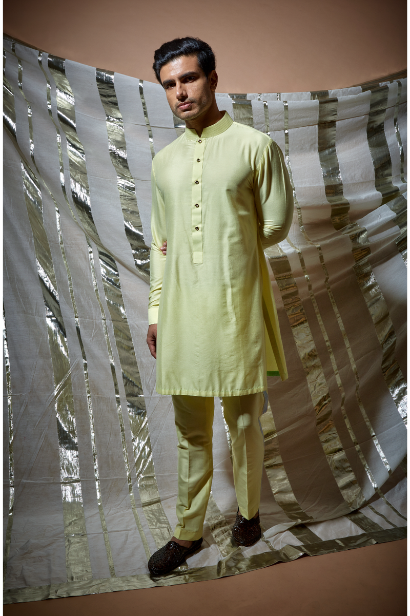 Yellow zari textured bandi jacket with blue detail paired with yellow kurta and pyjama pants - Kunal Anil Tanna