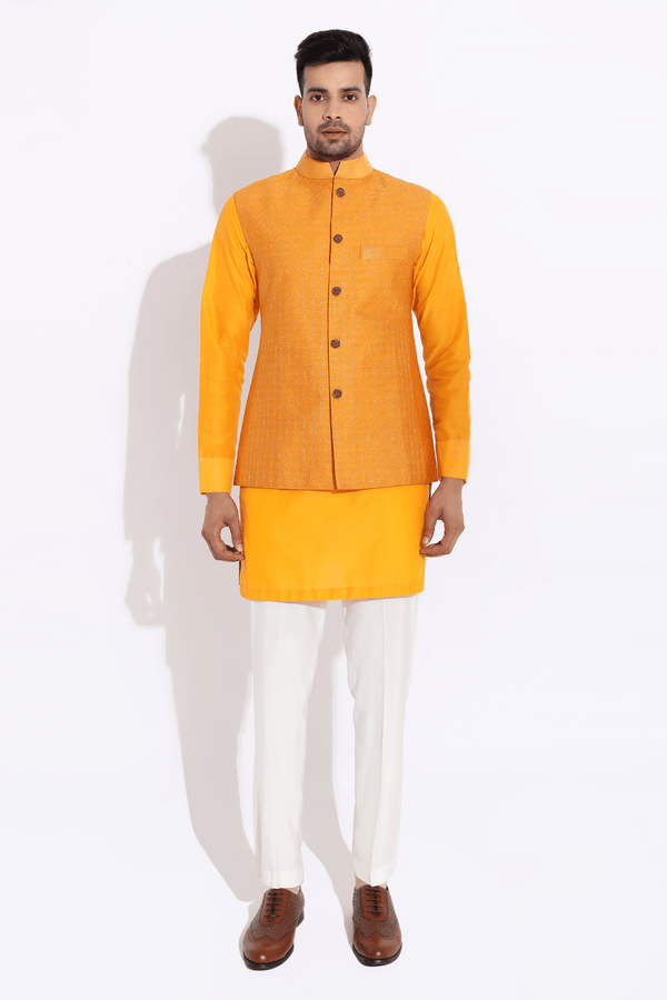 Orange textured bandi worn over orange kurta with aligarhi - Kunal Anil Tanna