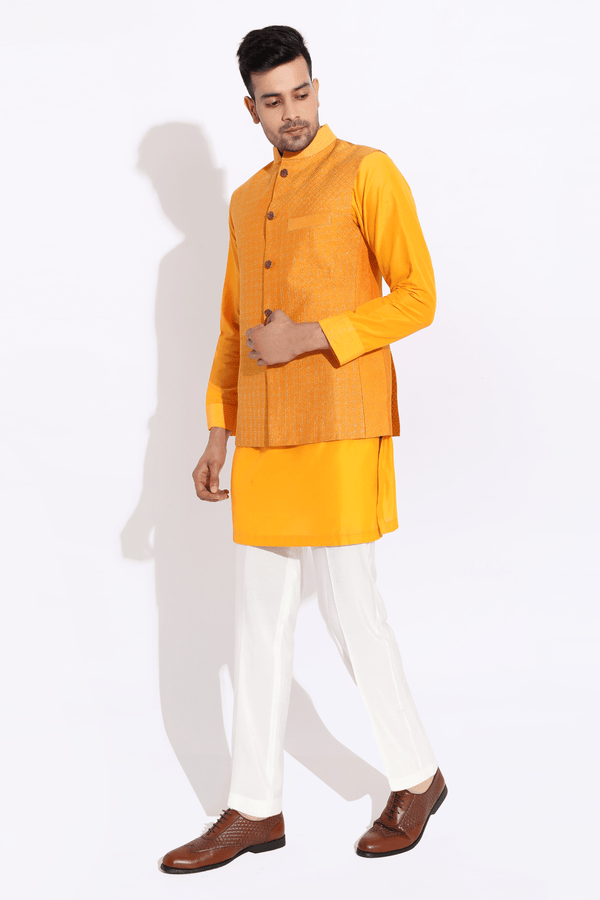 Orange textured bandi worn over orange kurta with aligarhi - Kunal Anil Tanna