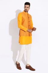 Orange textured bandi worn over orange kurta with aligarhi - Kunal Anil Tanna