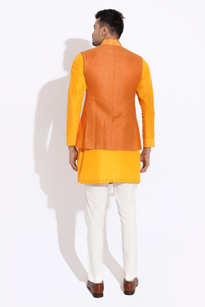 Orange textured bandi worn over orange kurta with aligarhi - Kunal Anil Tanna